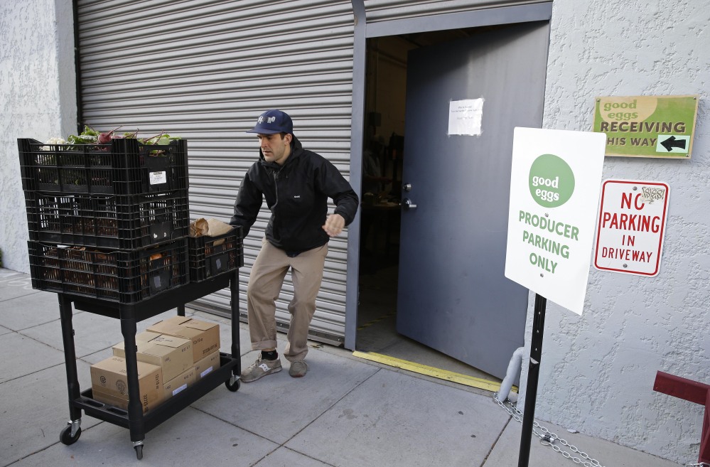Travis Jackson, of Dirty Girl Produce, in Santa Cruz, Calif., delivers a shipment to the Good Eggs warehouse in San Francisco. Good Eggs has built a fast-growing business connecting foodies and farmers in Northern California.