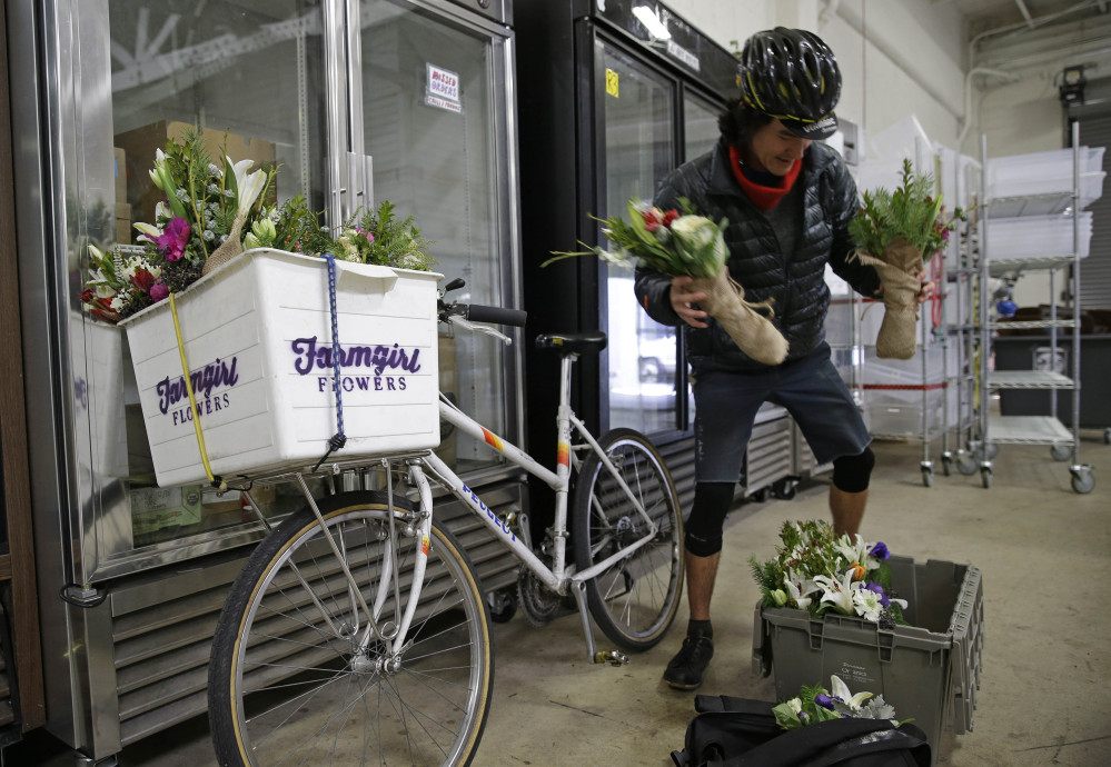 Ian Kizu-Blair, with Farmgirl Flowers, drops off a shipment to the Good Eggs warehouse in San Francisco.