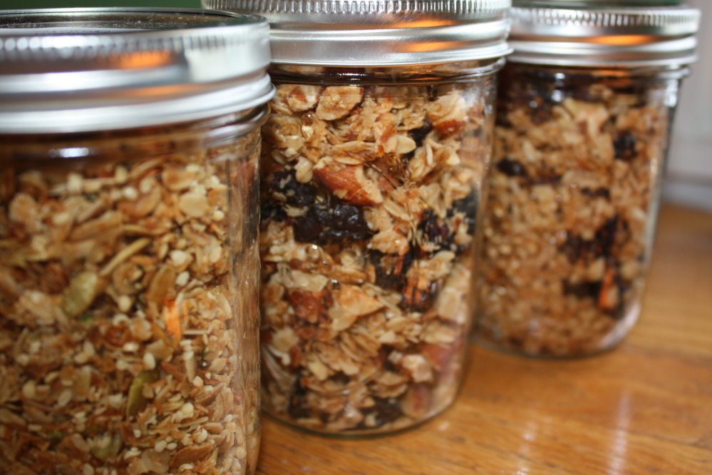 Once it has cooled, store granola in tightly sealed glass jars. From left, the jars contain hemp and pumpkin seed granola, cherry almond granola and cranberry walnut granola.
