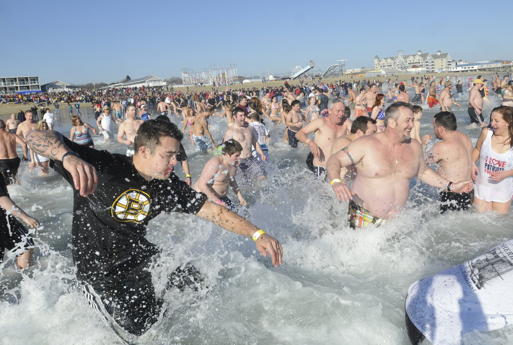 Hundreds participated in the Lobster Dip in Old Orchard Beach on Jan. 1, 2012.