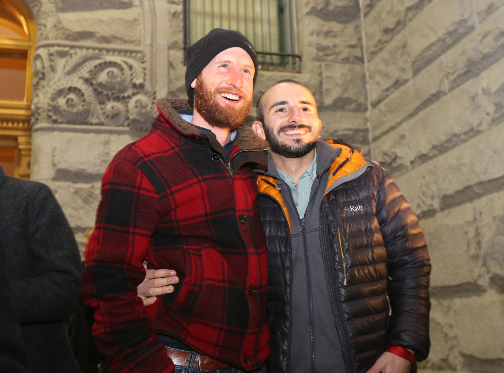 Derek Kitchen, left, and Moudi Sbeity, one of the gay couples that challenged Utah’s constitutional definition of marriage as about 1,500 people gather to show support of marriage equality at Washington Square, just outside of the Salt Lake City and County Building Monday, Dec. 23, 2013, in Salt Lake City.
