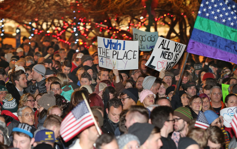 About 1,500 people gather to celebrate marriage equality after a federal judge declined to stay his ruling that legalized same sex marriage in Utah, at Washington Square just outside of the Salt Lake City and County Building Monday, Dec. 23, 2013, in Salt Lake City.