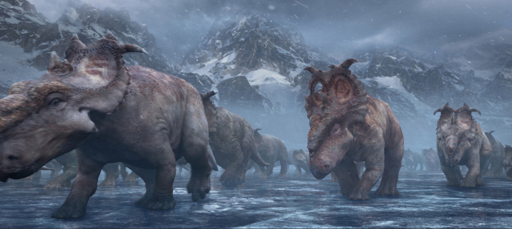 Patchi, center, walks with the herd in a scene from the film “Walking With Dinosaurs.”