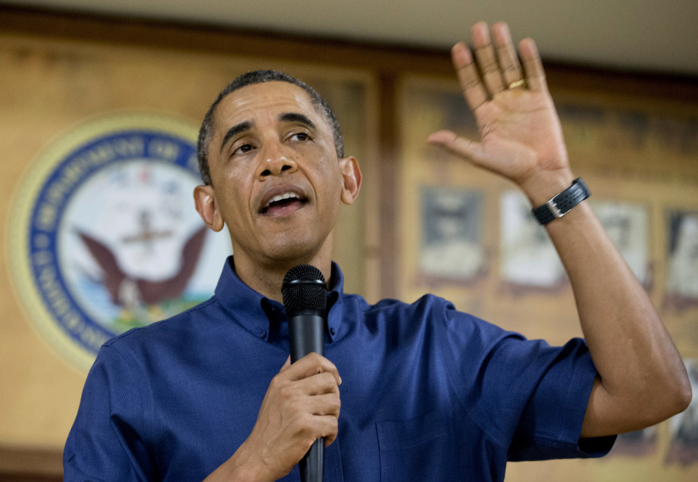 President Barack Obama speaks to members of the military and their families in Anderson Hall at Marine Corps Base Hawaii, on Wednesday in Kaneohe Bay, Hawaii. Obama signed the budget deal in Hawaii, where he spent the holiday with his family.