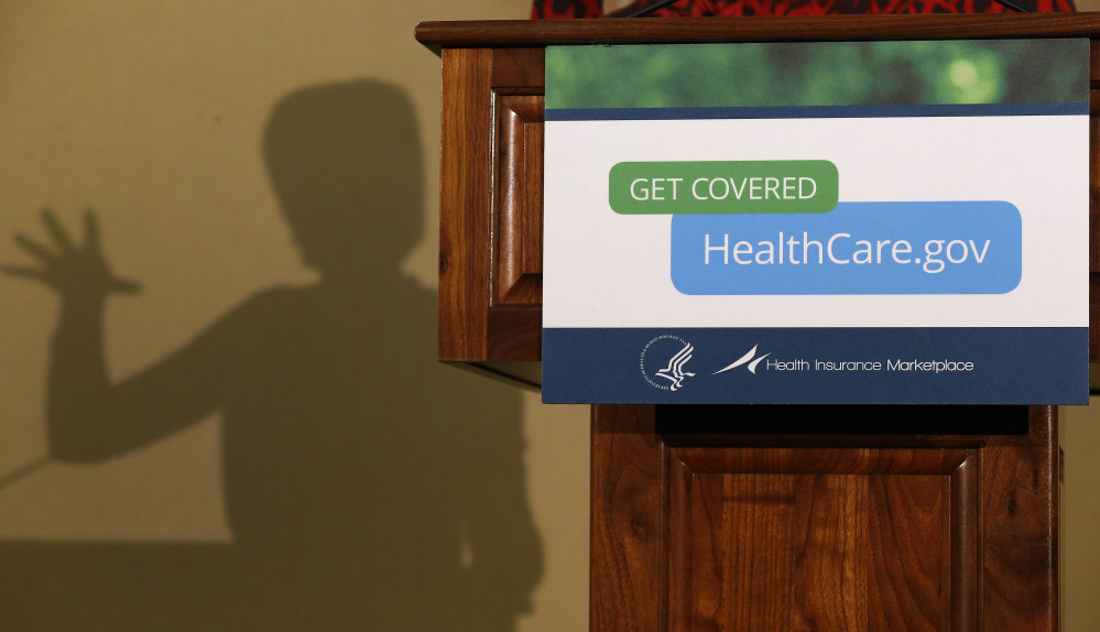 The shadow of Health and Human Services Secretary Kathleen Sebelius is cast on a wall as she speaks at the Community Health and Social Services Center in Detroit last month. President Barack Obama’s decision to allow people could keep health insurance policies slated for cancellation under the federal health overhaul has gotten a mixed response from insurers, state regulators and consumers.