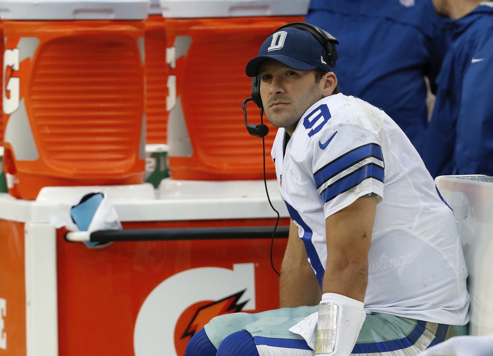 Dallas Cowboys quarterback Tony Romo sits on the bench during the second half of an NFL football game against the Washington Redskins in Landover, Md., Sunday, Dec. 22, 2013. Coach Jason Garrett said Romo had back surgery Friday, and Kyle Orton will start when Dallas faces Philadelphia on Sunday night with the NFC East title and a postseason berth on the line.