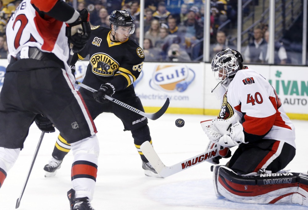 Ottawa Senators’ Robin Lehner (40) blocks a shot by Boston Bruins’ Brad Marchand (63) in the second period Friday.
