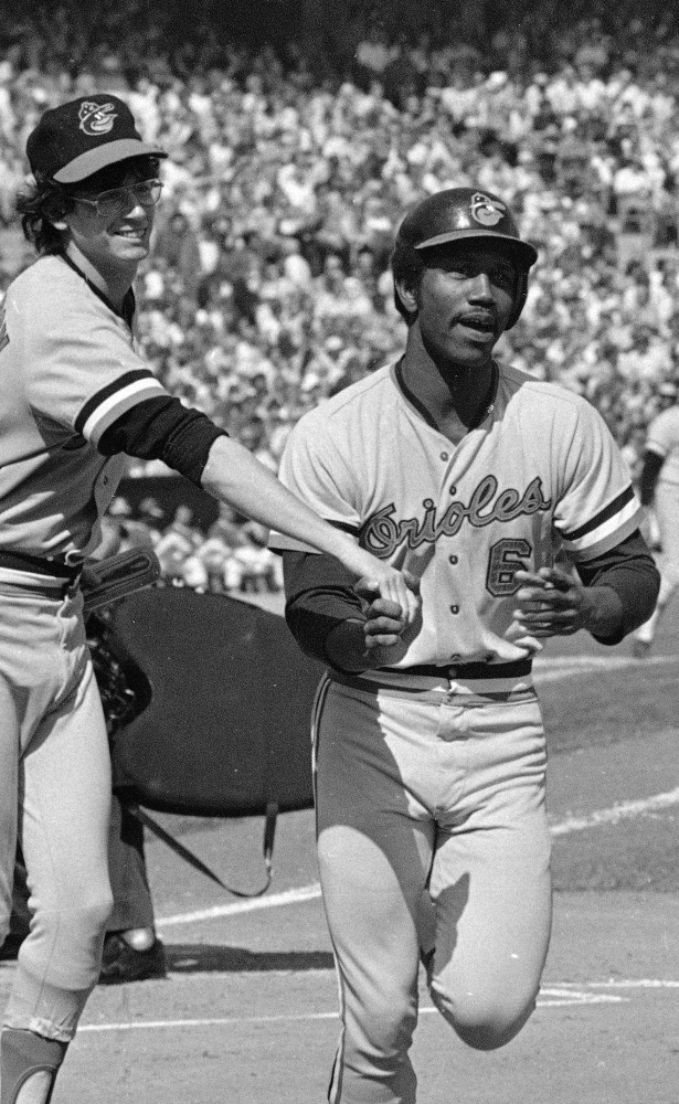 Paul Blair is greeted at the plate after hitting a home run in the opening game against the Oakland Athletics in the American League baseball playoffs in October 1974.
