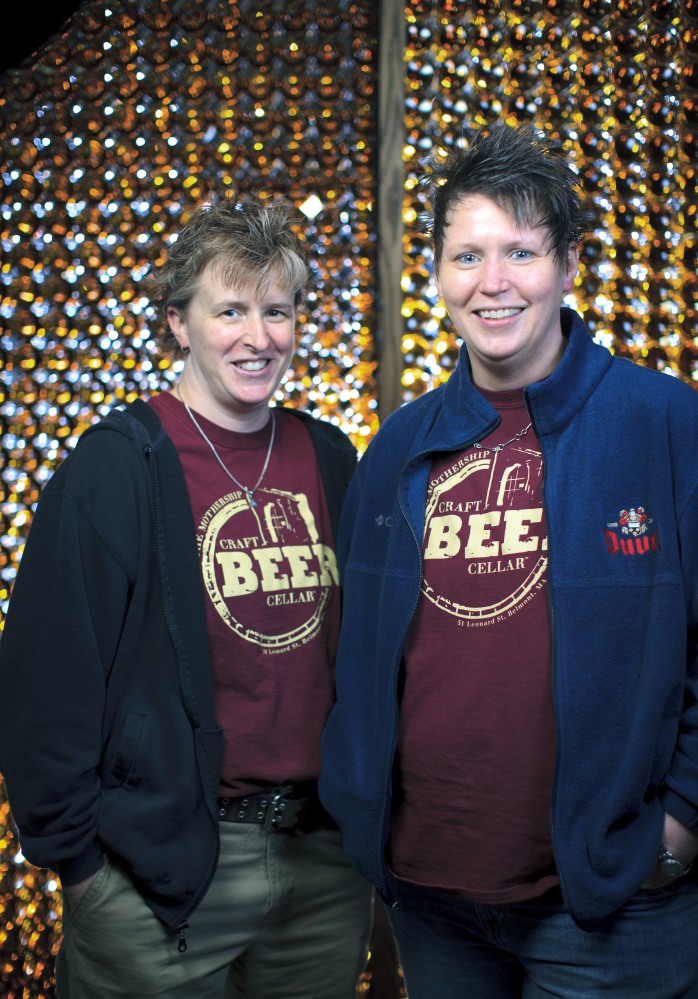Craft Beer Cellar founders Kate Baker, left, and Suzanne Schalow pose in Newton, Mass.