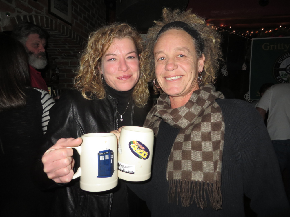 Gritty’s Mug Club members Tina Deschaine and Kristin Espey, both of Portland, feel at home at Gritty’s.