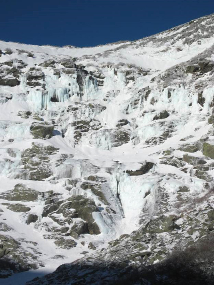 This photo released by the U.S. Forest Service shows the Lip area as it looked on Dec 24. The Lip is the section in the upper right corner. Two hikers who triggered an avalanche on Mount Washington that carried them 800 feet over rocks, cliffs and ice were rescued early Sunday, and treated for non-life-threatening injuries, officials said.