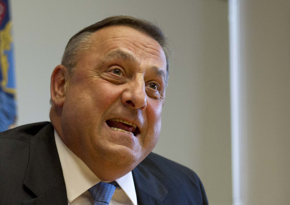 Maine Gov. Paul LePage speaks to reporters at the State House in Augusta.