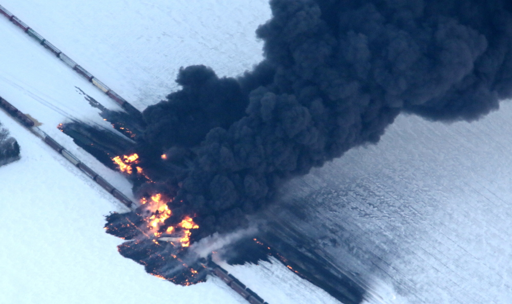 Fire from an oil train derailment burns uncontrollably Monday as seen in this aerial photograph taken west of Casselton, N.D. No one was reported hurt in the derailment or fire, but officials were evacuating people as a precaution.