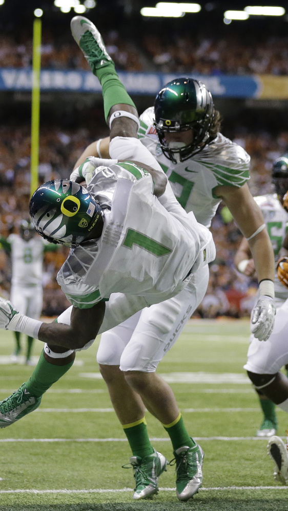 Oregon’s Josh Huff dives for a touchdown against Texas during the second quarter of Monday’s Alamo Bowl, won by the Ducks, 30-7.