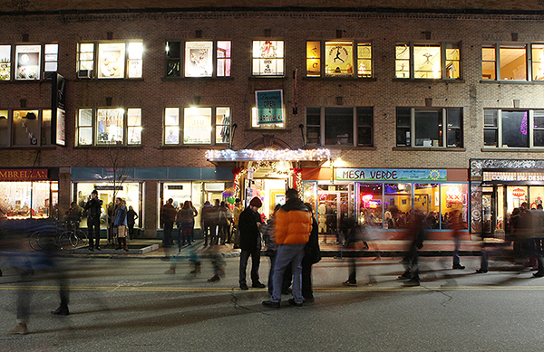 Pedestrians walk down a section of Congress Street closed to traffic during the First Friday Art Walk in Portland.