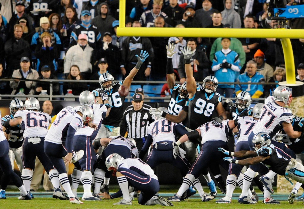 New England Patriots kicker Stephen Gostkowski (3) kicks against the Carolina Panthers during the second half of an NFL football game in Charlotte, N.C., Monday, Nov. 18, 2013. (AP Photo/Mike McCarn)