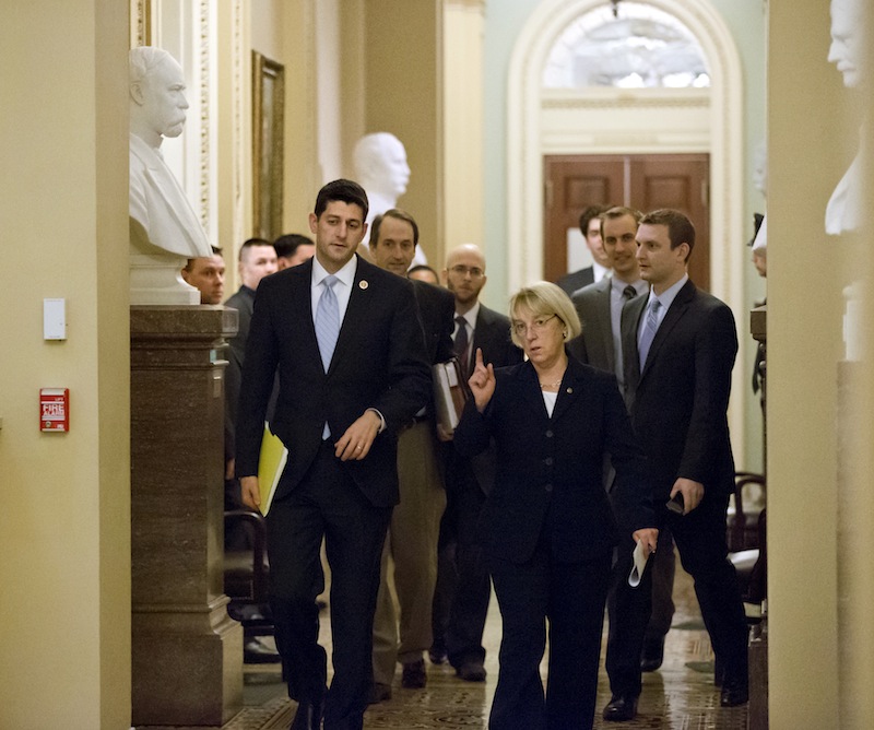 House Budget Committee Chairman Paul Ryan, R-Wis., left, and Senate Budget Committee Chairwoman Patty Murray, D-Wash., walk together on Dec. 10 to a news conference to announce a tentative agreement between Republican and Democratic negotiators on a government spending plan.