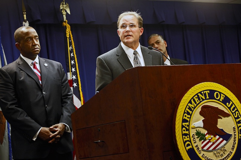 Bill Lewis of the FBI’s Los Angeles Division, at podium, comments on the five criminal cases filed against 18 current and former Los Angeles County sheriff’s deputies as part of an FBI investigation into allegations of civil rights abuses and corruption in the nation’s largest jail system. At left is Andre Birotte, U.S. Attorney for the Central District of California.