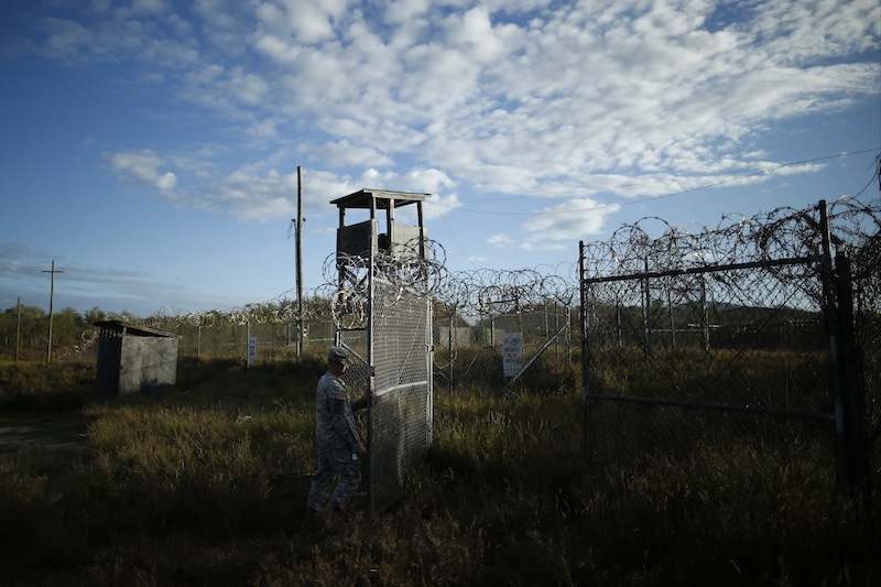 A soldier closes the gate at the now abandoned Camp X-Ray at Guantanamo Bay Naval Base, Cuba, which was used as the first detention facility for al-Qaida and Taliban militants who were captured after the Sept. 11 attacks.