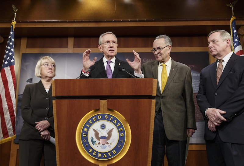 From left, Sen. Patty Murray, D-Wash., chair of the Senate Budget Committee, Senate Majority Leader Harry Reid, D-Nev., Sen. Chuck Schumer, D-N.Y., and Senate Majority Whip Dick Durbin, D-Ill., talk to reporters Thursday about the final work of the Senate as their legislative year nears to a close, at the Capitol in Washington. Reid promises a vote no later than Jan. 7 on a measure to extend jobless benefits for three months. He said the number of jobless people out of work for more than six months is far greater than in past economic recoveries.