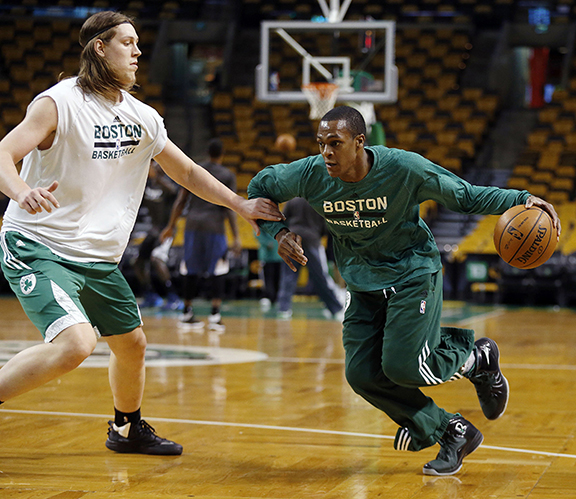 Boston Celtics' Rajon Rondo, right, works out with teammate Kelly Olynyk before an NBA basketball game against the Minnesota Timberwolves in Boston, Monday, Dec. 16, 2013.