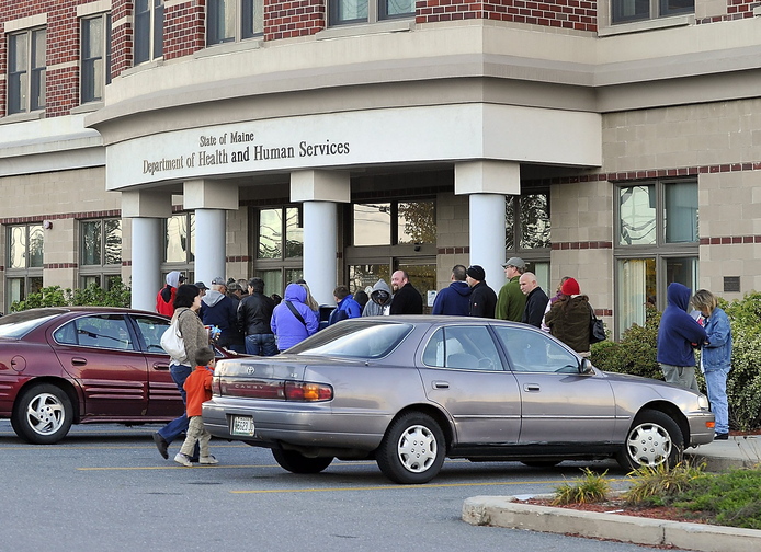 People line up outside the DHHS Building on Marginal Way in Portland before it opens in this October 2010 photo. DHHS offices have been on Marginal Way for the past 20 years and have been in the city even longer.