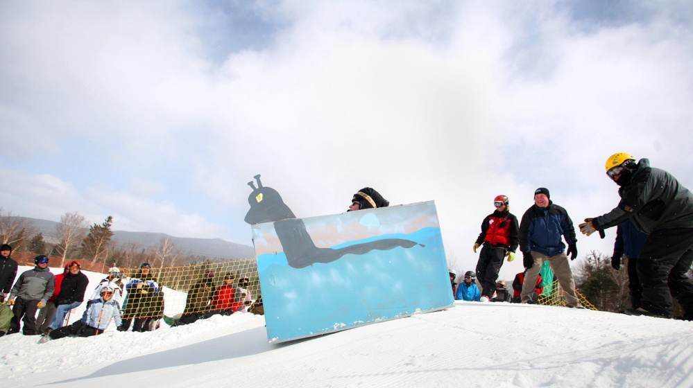A cardboard sled called “The Mooselook Monster” heads down the slope during the Cardboard Box Race at Saddleback Mountain in Rangeley in 2011.