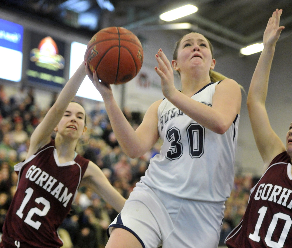 Portland’s Brianna Holdren drives for a key breakaway basket in the closing seconds against Gorham to secure a 47-42 win in a Western Class A girls’ basketball quarterfinal at the Portland Expo.