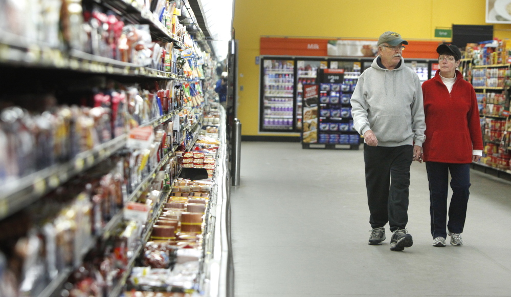 Skip and Thea Murphy of Sanford walk around the inside perimeter of the 198,000-square-foot Walmart in Sanford.
