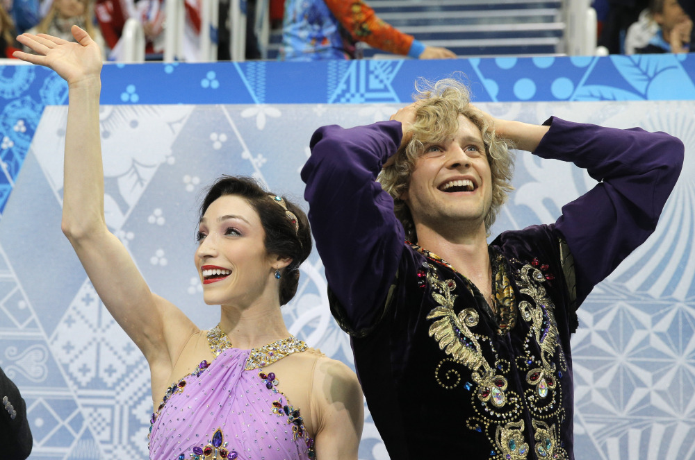 Meryl Davis and Charlie White of the United States react in the results area after competing in the ice dance free dance figure skating finals at the Iceberg Skating Palace during the 2014 Winter Olympics, on Monday in Sochi, Russia.