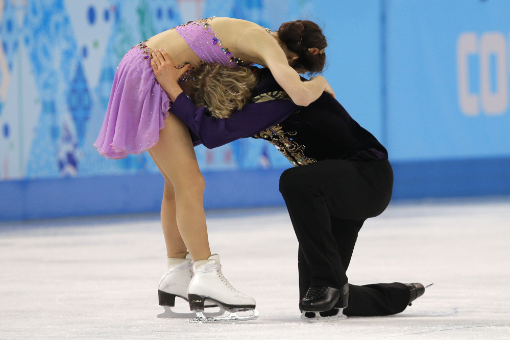 Meryl Davis and Charlie White of the United States embrace after completing their routine in the ice dance free dance figure skating finals at the Iceberg Skating Palace during the 2014 Winter Olympics on Monday in Sochi, Russia.