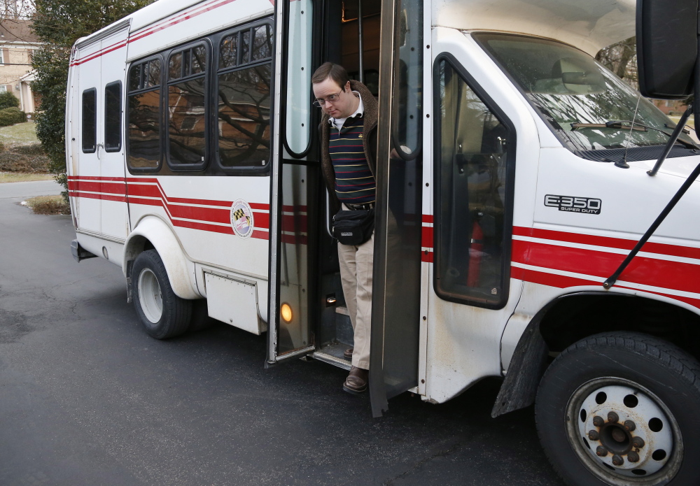 Matthew McMeekin gets off a bus at his home in Bethesda, Md., after a day of work. McMeekin has spent 14 years working at the nonprofit Rehabilitation Opportunities Inc.