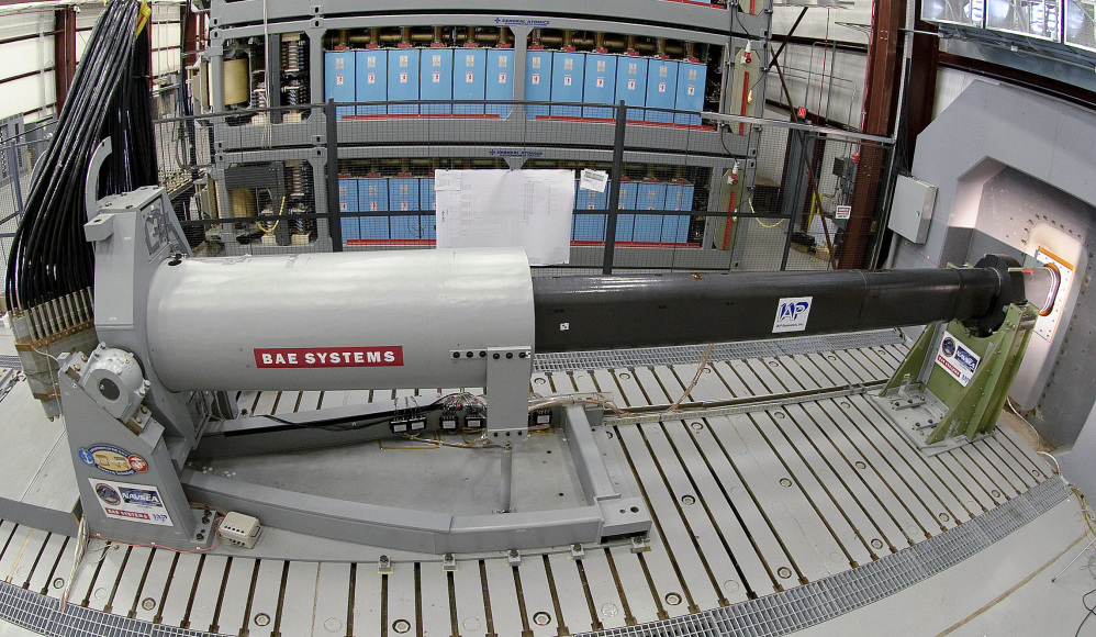 Engineers prepare to test an electromagnetic railgun prototype launcher at a test facility in Dahlgren, Va.