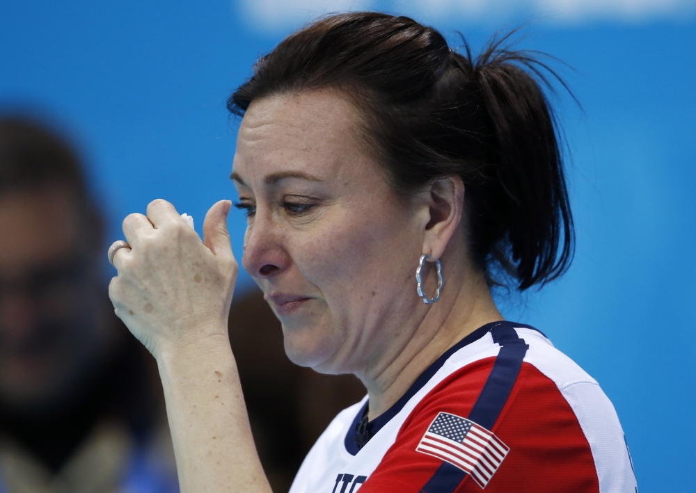 American Ann Swisshelm wipes away tears after losing to South Korea during women’s curling competition against at the 2014 Winter Olympics on Monday in Sochi, Russia.