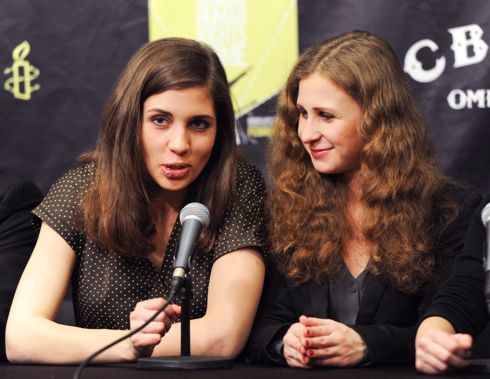 In this Feb. 5, 2014, photo, Nadezhda Tolokonnikova, left, and Maria Alekhina of Pussy Riot, participate in a press conference for Amnesty International’s “Bringing Human Rights Home” concert at the Barclays Center in New York.