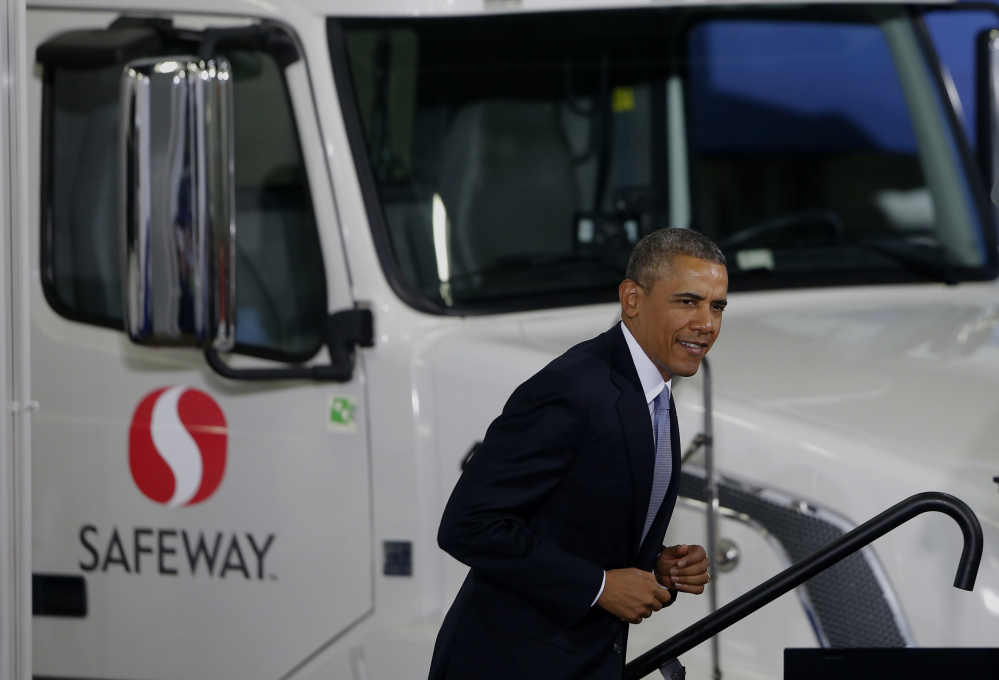 President Barack Obama arrives to speak at a distribution center for Safeway stores in Upper Marlboro, Md., on Tuesday. In addition to calling for tougher fuel efficiency standards for trucks, Obama was to renew his call for Congress to end billions of dollars in federal subsidies to oil and natural gas companies.