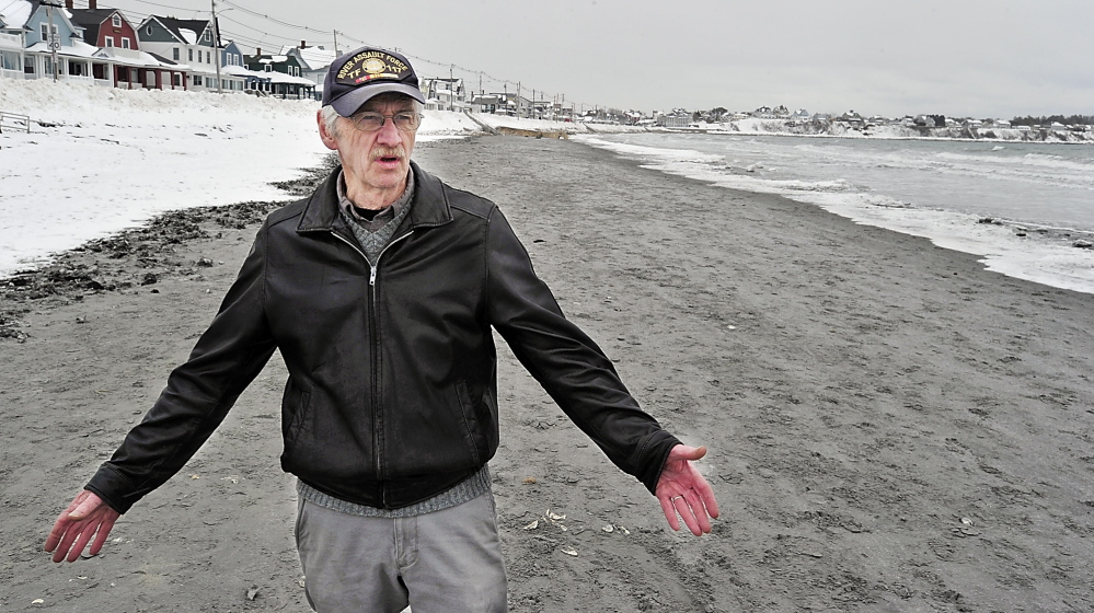 York Selectman Ron Nowell walks Tuesday along Long Sands Beach in York as he talks about the ramifications of not addressing private-property ownership along the shore.