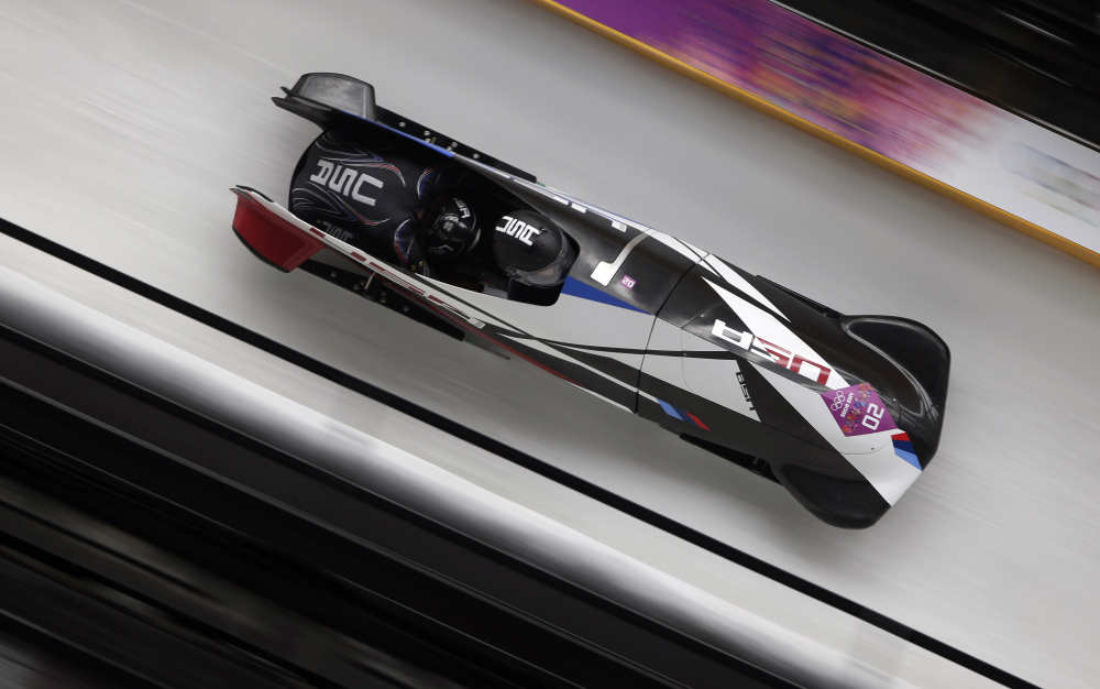 The team from the United States USA-1, piloted by Elana Meyers with brakeman Lauryn Williams, speed down the track during the women’s two-man bobsled competition at the 2014 Winter Olympics, Tuesday, Feb. 18, 2014, in Krasnaya Polyana, Russia.