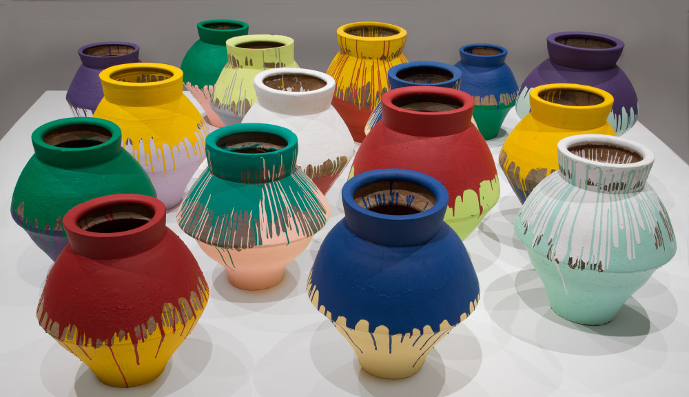 In this undated photo made available by the Brooklyn Museum of Art, shows a series of 16 vases that are part of an installation by Chinese artist Ai Weiwei and currently on display at the Perez Art Museum in Miami.