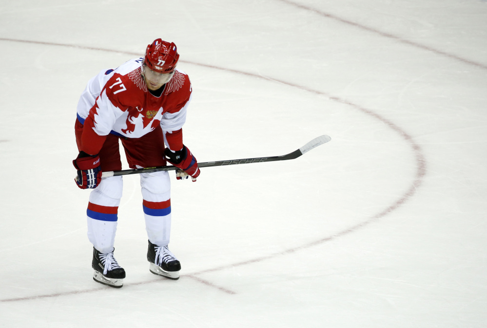 Russia defenseman Anton Belov reacts at the end of a men’s quarterfinal ice hockey game against Russia at the 2014 Winter Olympics, Wednesday, Feb. 19, 2014, in Sochi, Russia. Finland won 3-1.