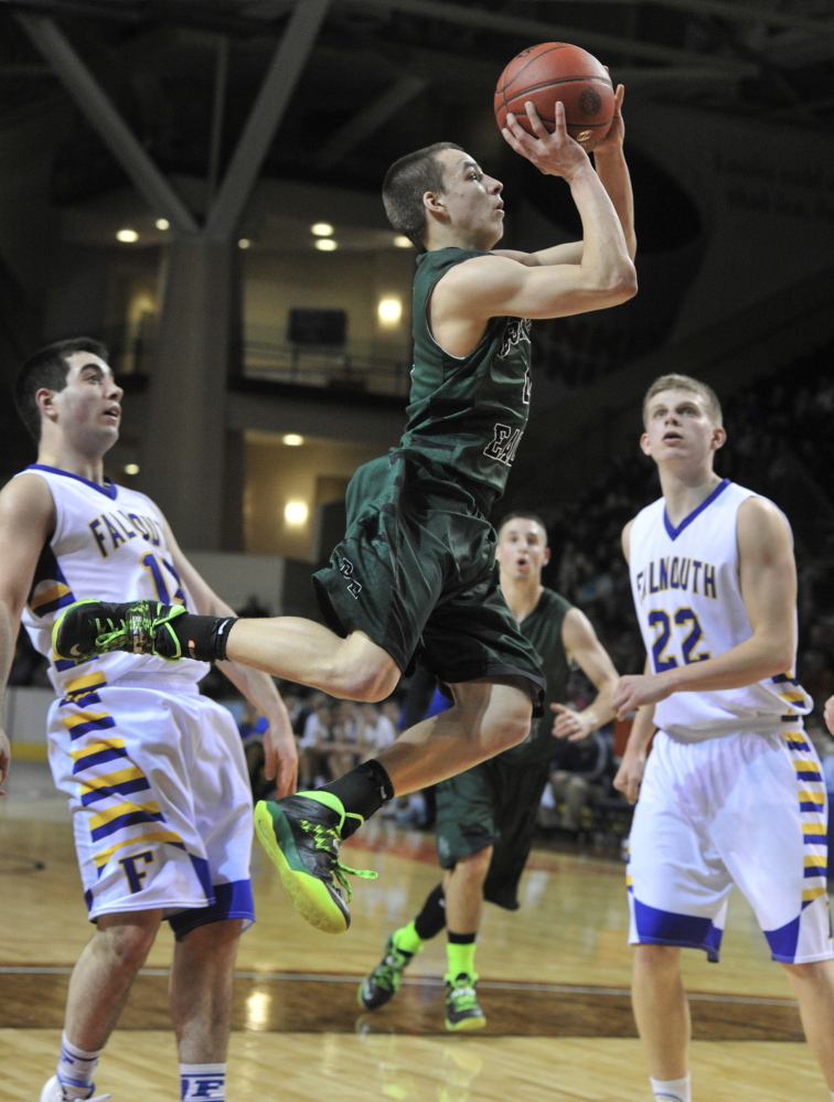 Dustin Cole of Bonny Eagle sails to the basket in front of Falmouth’s Tom Coyne, left, and Jack Simonds during their Western Class A boys’ basketball semifinal Wednesday night at the Cumberland County Civic Center. Cole scored 22 points, including 17 in the fourth quarter, to lead the Scots to a 62-61 win.