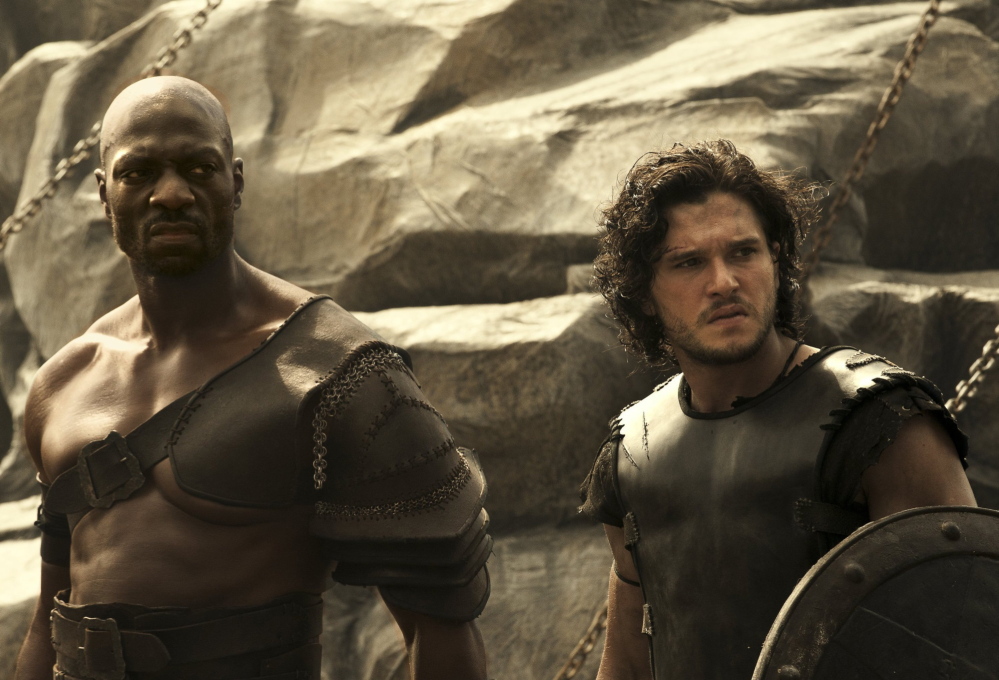 Adewale Akinnuoye-Agbaje, left, and Kit Harington are gladiator foes who become allies in “Pompeii.”