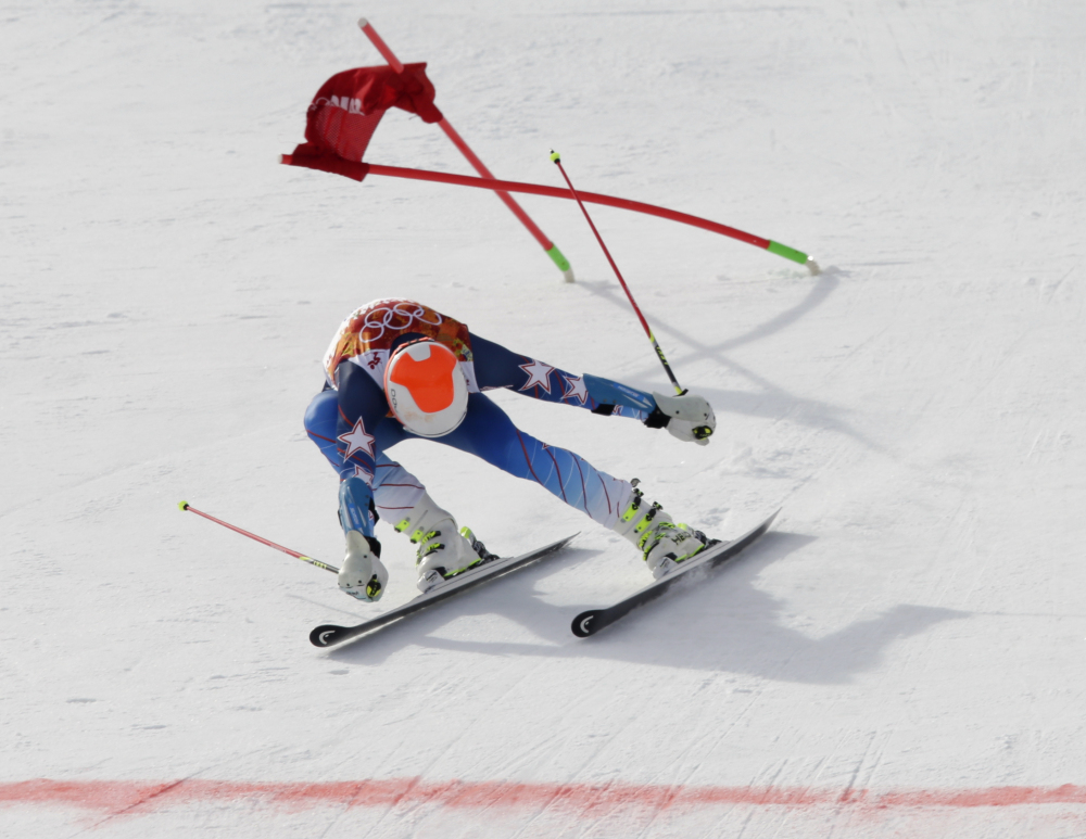 Bode Miller skis past a gate near the finish line during the first run of the men’s giant slalom the Sochi 2014 Winter Olympics on Wednesday.