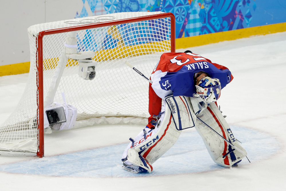 Czech Republic goaltender Alexander Salak looks down at the ice after the team’s 5-2 loss to the United States in the men’s quarterfinal hockey game in Shayba Arena at the 2014 Winter Olympics on Wednesday in Sochi, Russia.