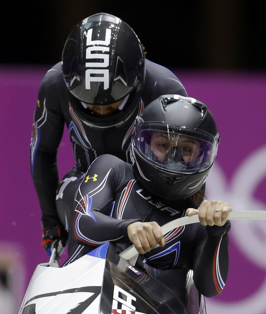 The team from the United States USA-1, piloted by Elana Meyers with brakeman Lauryn Williams, start their third run during the women’s bobsled competition at the 2014 Winter Olympics, Wednesday, Feb. 19, 2014, in Krasnaya Polyana, Russia.