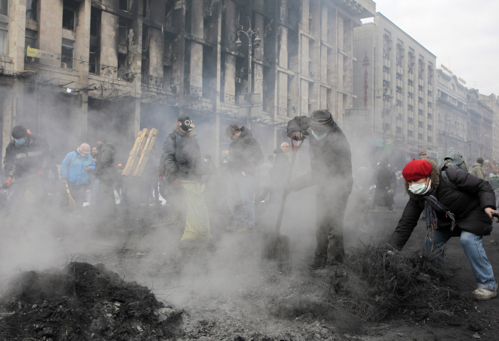 Activists reinforce the barricades in Kiev’s Independence Square, the epicenter of the country’s current unrest, Thursday.