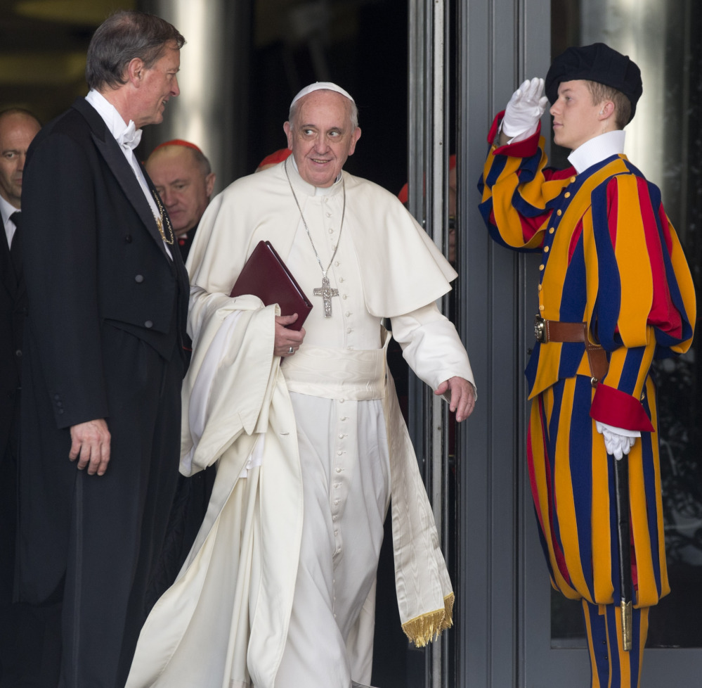Pope Francis leaves at the close of the morning session in the Synod hall at the Vatican City on Friday. He urges his cardinals to find ways to provide pastoral care that is ‘intelligent, courageous and full of love” for divorced and remarried Catholics.