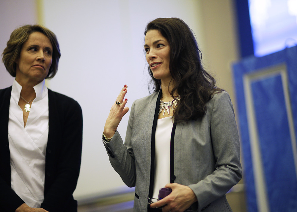 Former Olympic figure skater Nancy Kerrigan, right, stands next to NBC figure skating analyst Mary Carillo, as she speaks after a screening of a new documentary about the 1994 attack on her which will air the day of the 2014 Winter Olympics closing ceremony, Friday, Feb. 21, 2014, in Sochi, Russia. Kerrigan has been reluctant to talk about rival Tony Hardingís ex-husband hiring a hit squad to take her out before the 1994 Olympics in Lillehammer. She finally relented for a show that marks the 20-year anniversary of the incident, which thrust figure skating into the spotlight and spawned an international media frenzy. (AP Photo/David Goldman)
