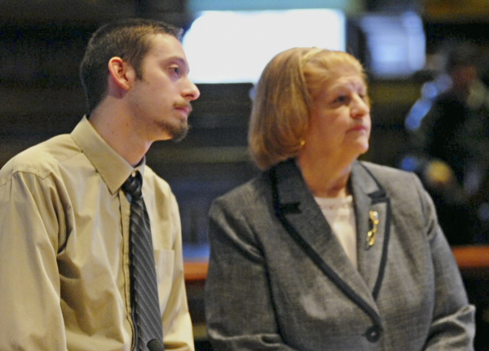 Sentenced to prison: Attorney Pam Ames, right, stands beside Joshua A. Erskine, 25, as he apologizes to the family of 81-year-old Ruth Epperson during sentencing on Friday in Kennebec County Superior Court in Augusta.