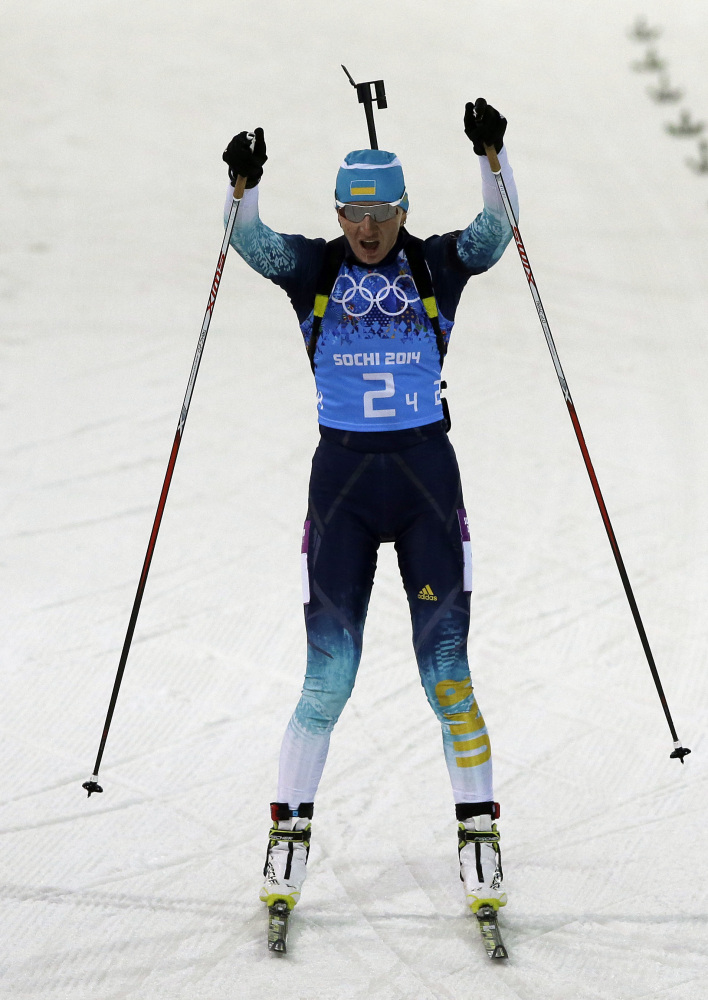 Ukraine’s Olena Pidhrushna celebrates as she crosses the finish line to win the gold medal in the women’s biathlon 4x6k relay at the 2014 Winter Olympics.